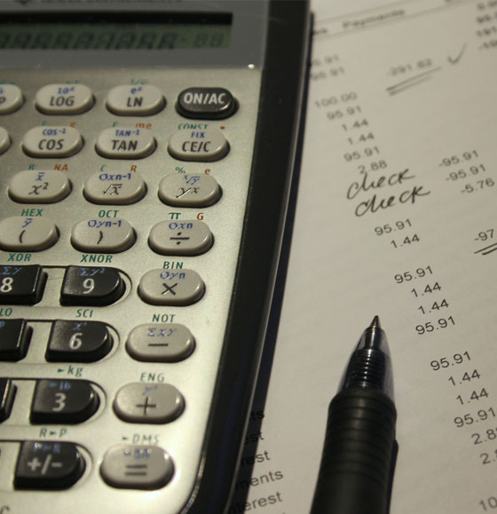 Up close view of calculator and accounting for loan modification.